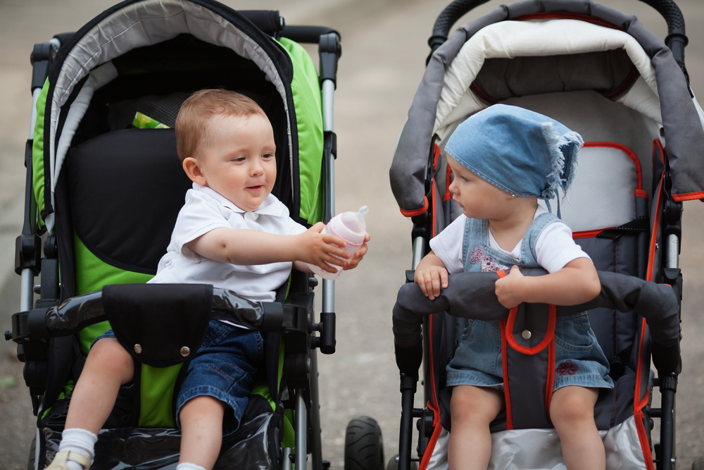 little funny boy gives water bottle to girlfriend