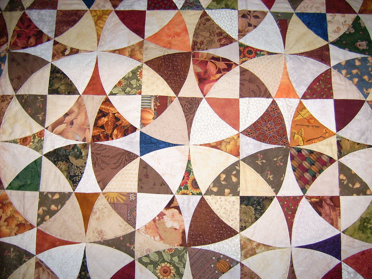 1200px-patchwork_-_curvas_concentricas