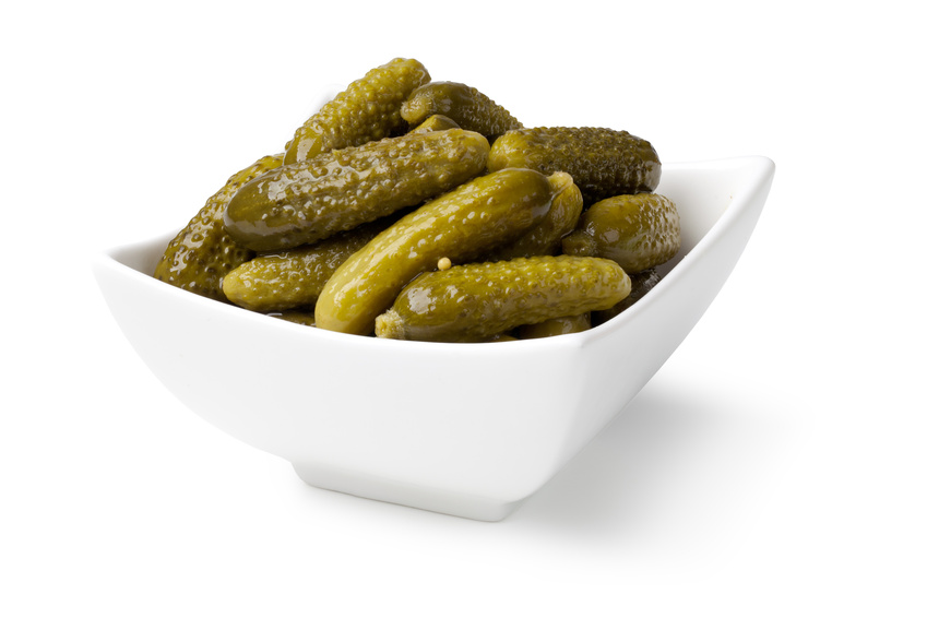 Pickled cucumbers on white background