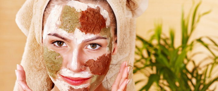 Natural homemade clay facial masks at home .