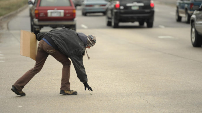 A passing motorist crumbled up a dollar bill and tried to throw it at Angel. She chased it out in the middle of the intersection. "Some people are really rude," she says. "I have a few people that they do it continuously so I started talking back to them. This girl told me to find a ‘different corner bitch.’ And I told her ‘if it bothers you that much find a different street.’"