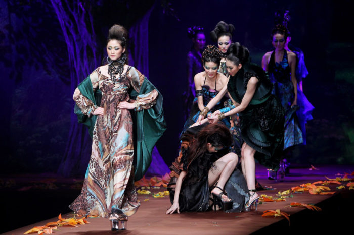 BEIJING - MARCH 29: A model is helped after falling down on the runway because of too high heel during AsahiKASEI Prize Zhang Yichao Show at China Fashion Week on March 29, 2010 in Beijing, China. (Photo by Feng Li/Getty Images)