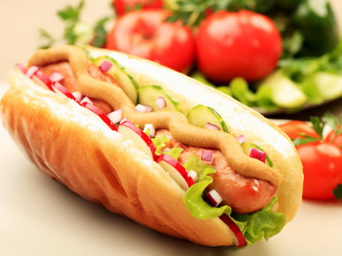 Close up of hot dog. Fast food. Isolated over white background.