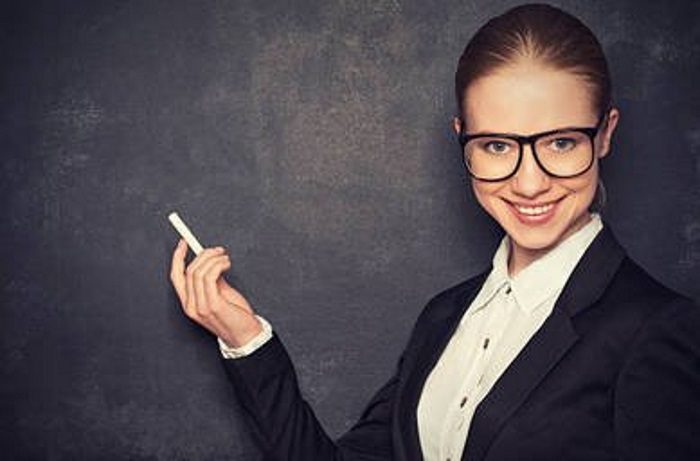 37844618-business-woman-teacher-with-glasses-and-chalk