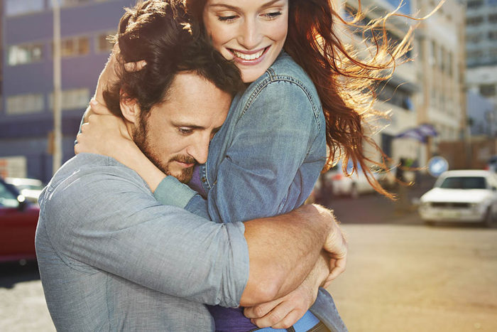 Couple embracing in the city