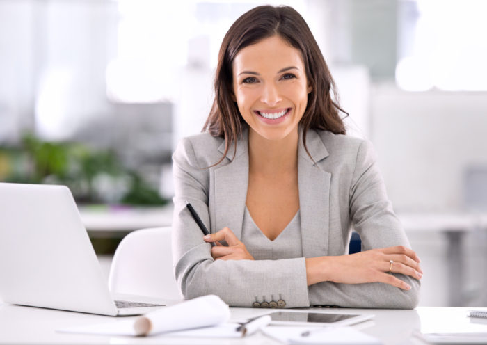 Shot of an attractive businesswoman sitting at her desk in an officehttp://195.154.178.81/DATA/i_collage/pi/shoots/783151.jpg