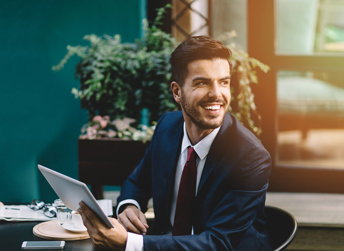 Businessman having a coffee break at a sidewalk cafe in Istanbul