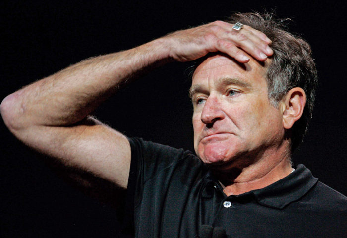 Actor-comedian Robin Williams reacts to a question from a member of the audience during Google co-founder Larry Page's keynote speech at the Consumer Electronics Show in Las Vegas, Nevada in this file picture taken January 6, 2006. Oscar-winning actor and comedian Williams was found dead on Monday from an apparent suicide at his home in Northern California, Marin County Sheriff's Office said. He was 63. REUTERS/Steve Marcus/Files (UNITED STATES - Tags: ENTERTAINMENT OBITUARY)