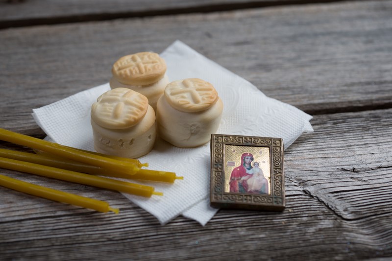 Prosfora from the Orthodox Church and a burning candle