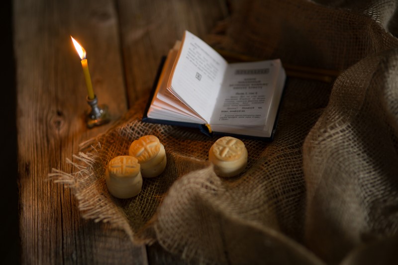 Prosfora from the Orthodox Church and a burning candle