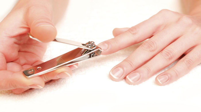 woman cutting nails