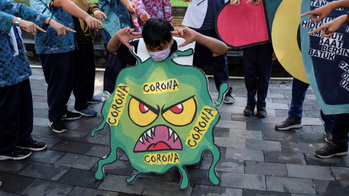 Students show a theatrical performance about coronavirus in Solo, Central Java, Indonesia, February 6, 2020 in this photo taken by Antara Foto. Antara Foto/Maulana Surya/via REUTERS ATTENTION EDITORS - THIS IMAGE WAS PROVIDED BY A THIRD PARTY. MANDATORY CREDIT. INDONESIA OUT.