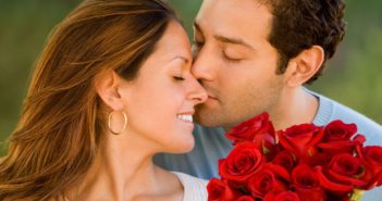 man-giving-flowers-to-wife